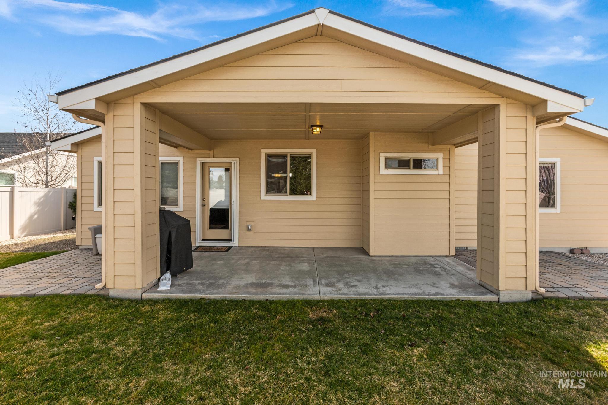 5832 West Rotherham Drive Eagle, ID 83616 - Photo 34 of 42 Rear view of house with a patio