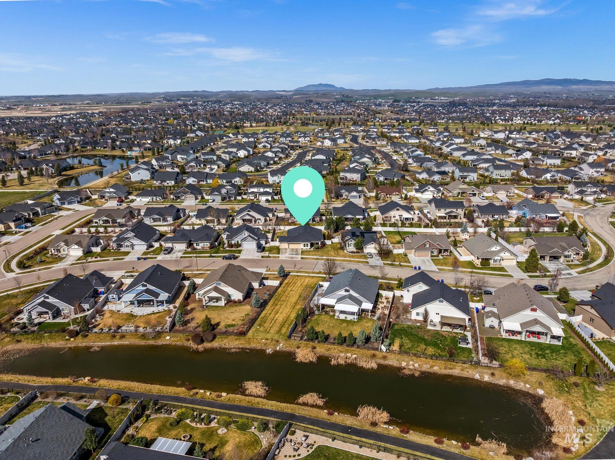 5832 West Rotherham Drive Eagle, ID 83616 - Photo 41 of 42 Aerial overview of property's location with nearby suburban area and a water and mountain view