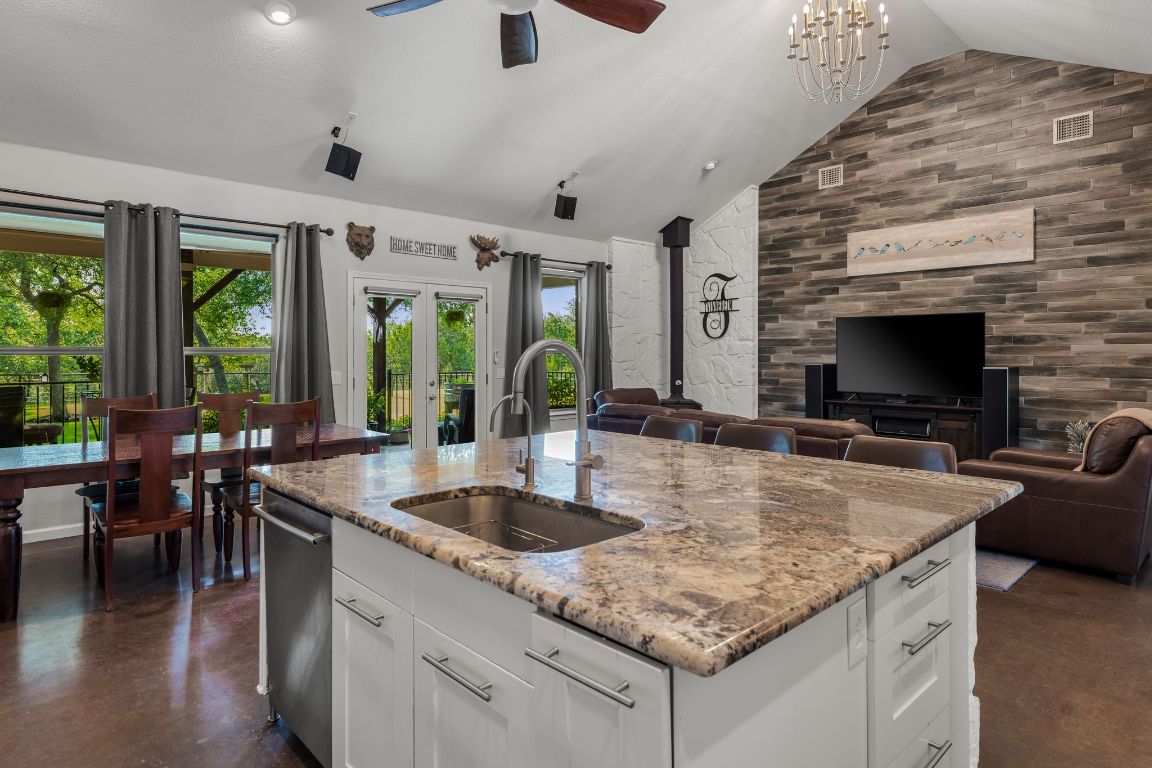 4204 Arthur Circle Leander, TX 78641 - Photo 17 of 40 a kitchen with granite countertop a sink and counter space