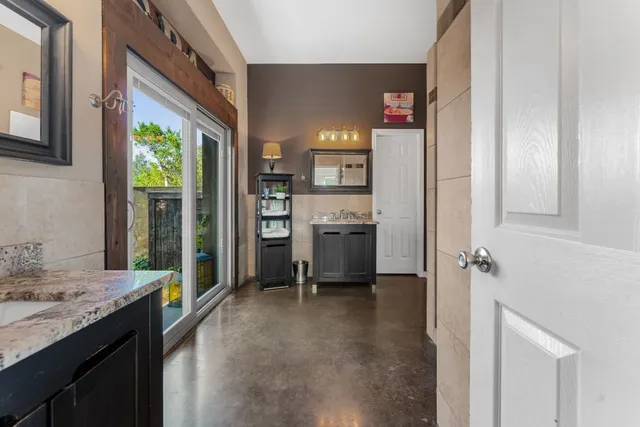 a view of a kitchen cabinets and a refrigerator