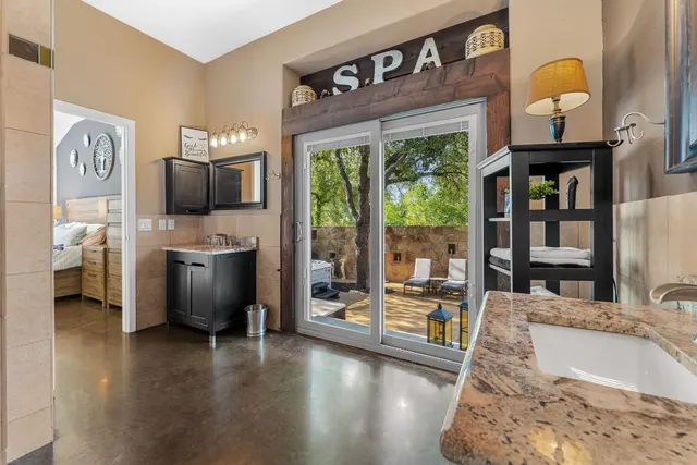 a living room with fireplace furniture and a floor to ceiling window
