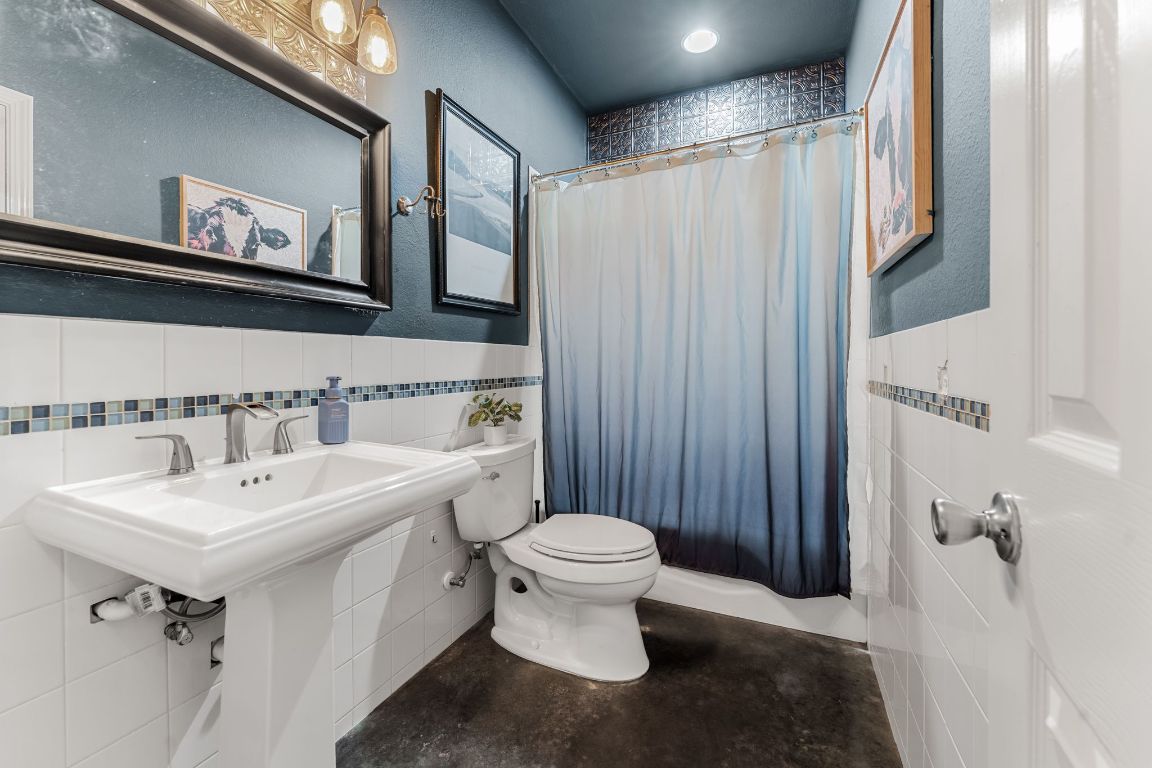 4204 Arthur Circle Leander, TX 78641 - Photo 24 of 40 a bathroom with a sink toilet and shower