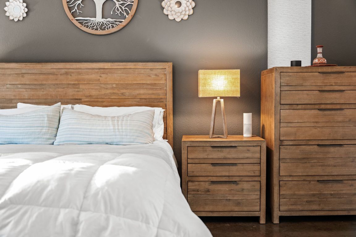 4204 Arthur Circle Leander, TX 78641 - Photo 10 of 40 a bedroom with a bed and a chandelier