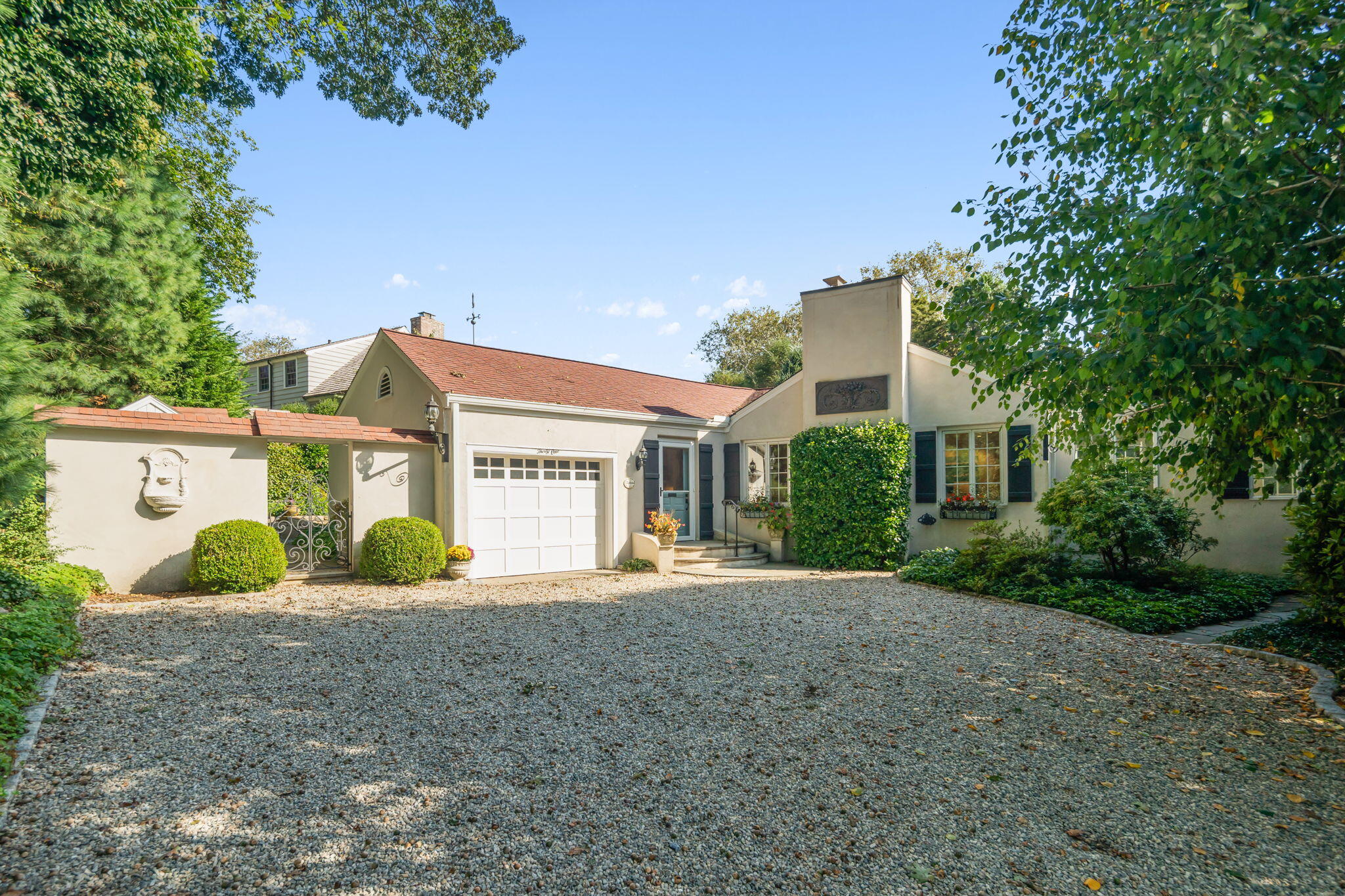 31 Crest Road Rowayton, CT 06853 - Photo 2 of 29 a front view of a house with a yard and garage