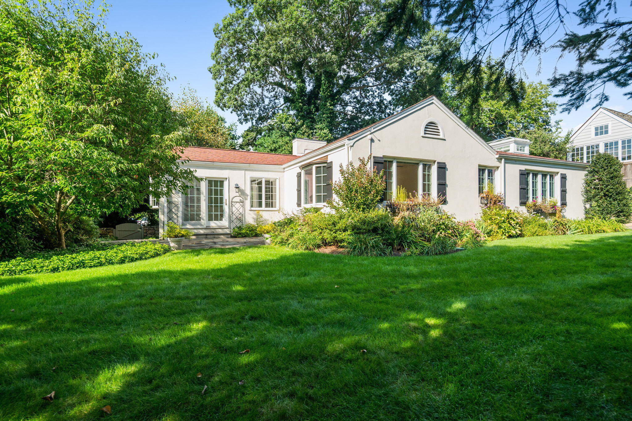 31 Crest Road Rowayton, CT 06853 - Photo 3 of 29 a front view of a house with a yard and trees