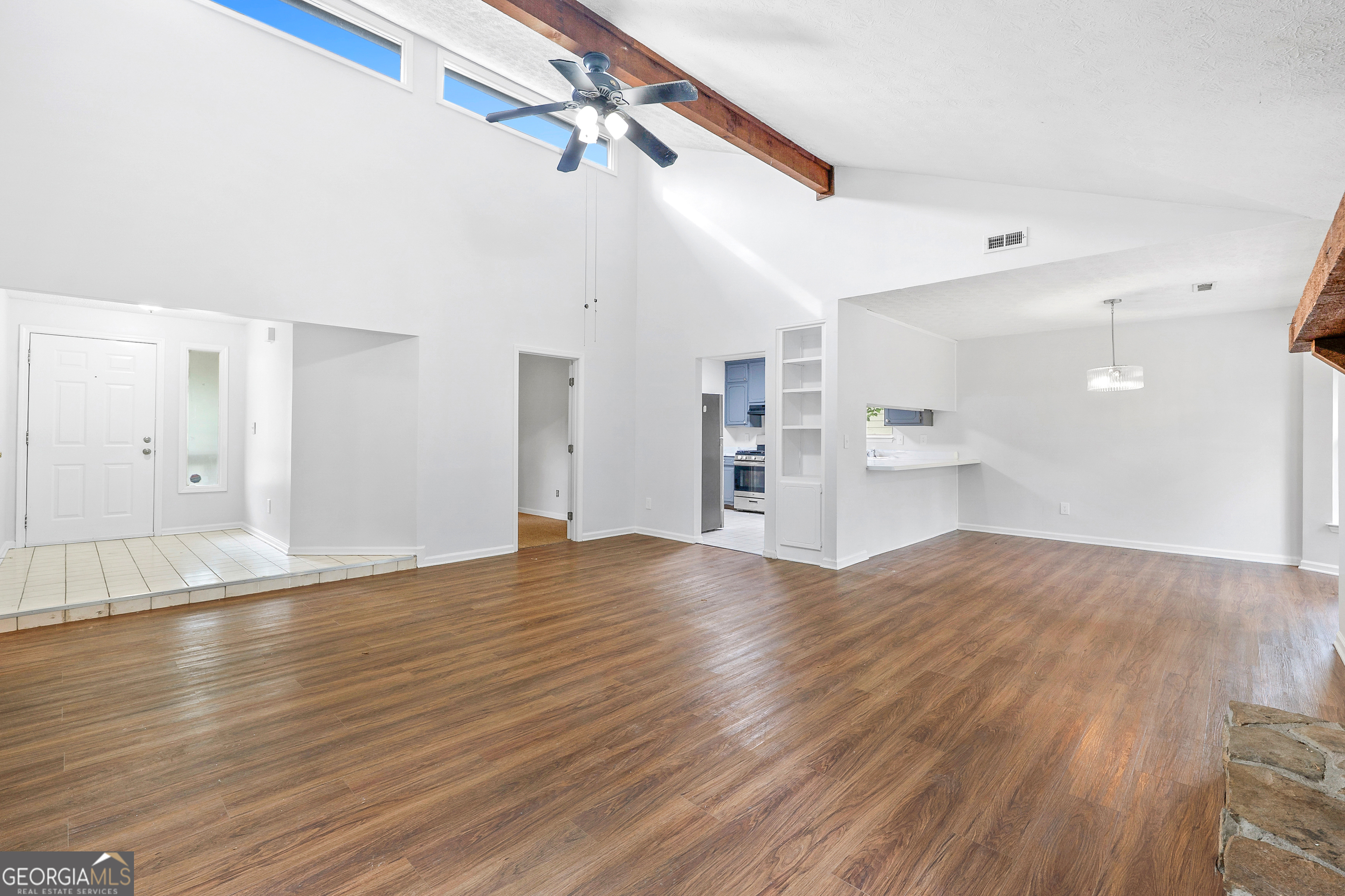 1328 Foxvale Drive Hampton, GA 30228 - Photo 10 of 27 a view of empty room with wooden floor