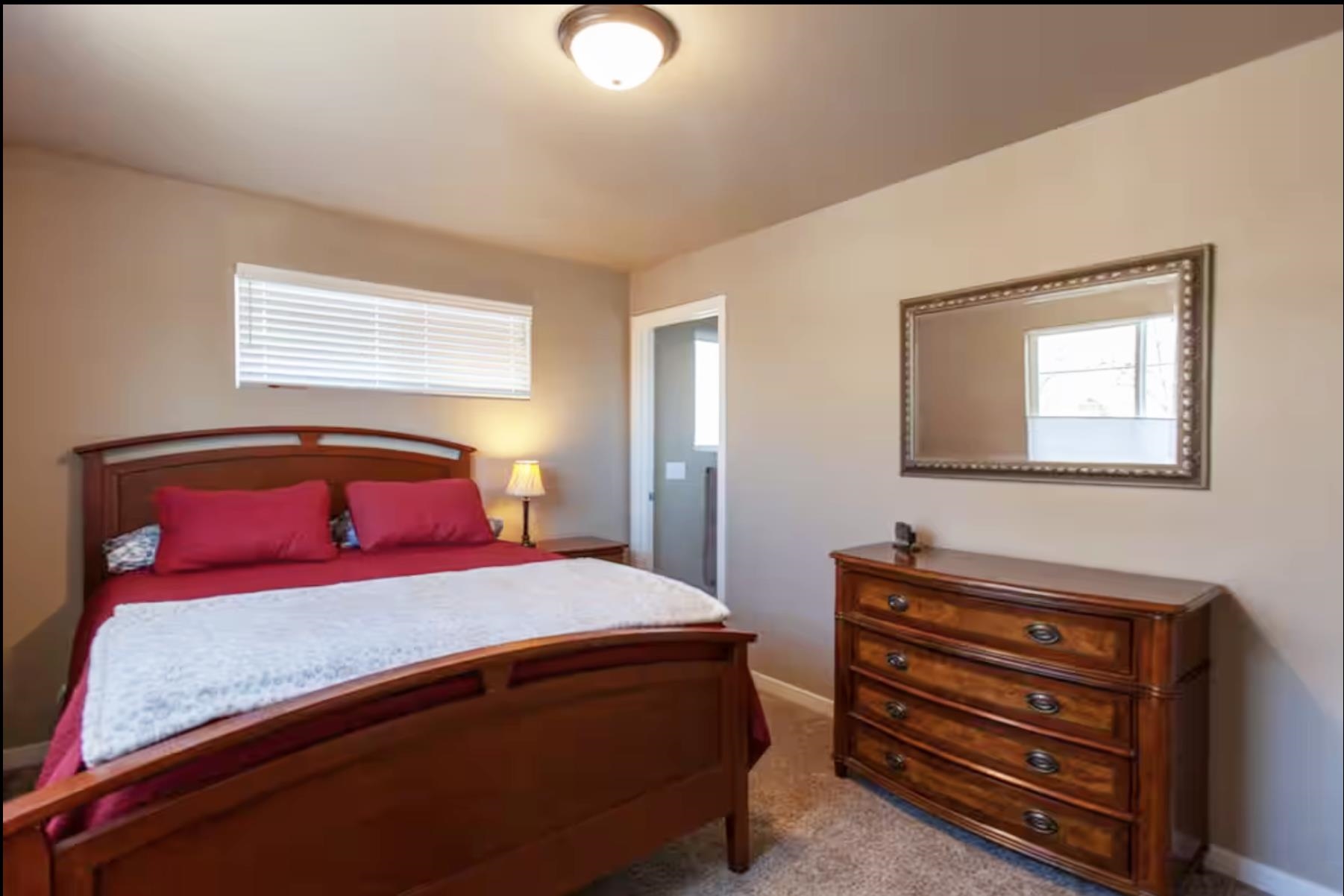 1460 Main Street Grand Junction, CO 81501 - Photo 20 of 31 a bedroom with a bed and a dresser