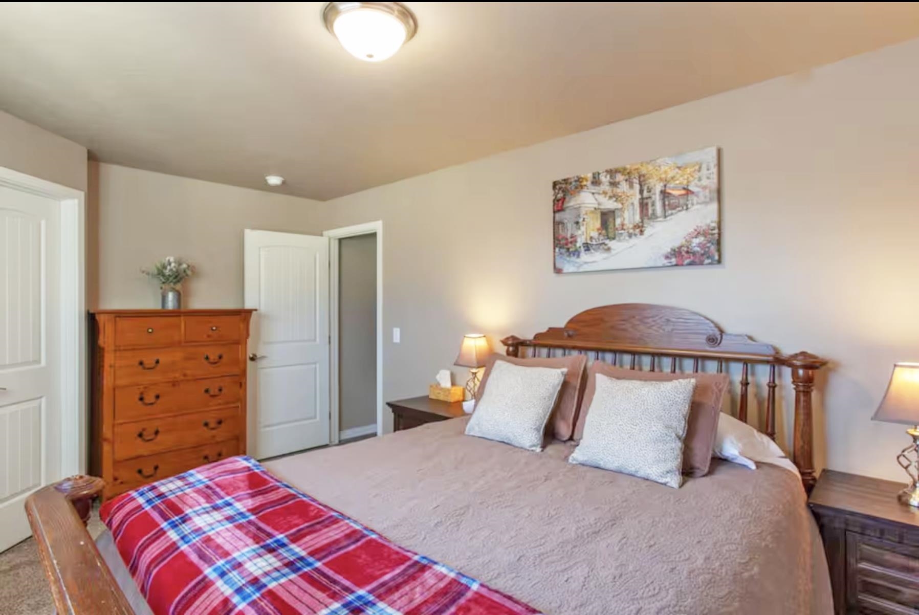 1460 Main Street Grand Junction, CO 81501 - Photo 22 of 31 a bedroom with a bed and a dresser in it