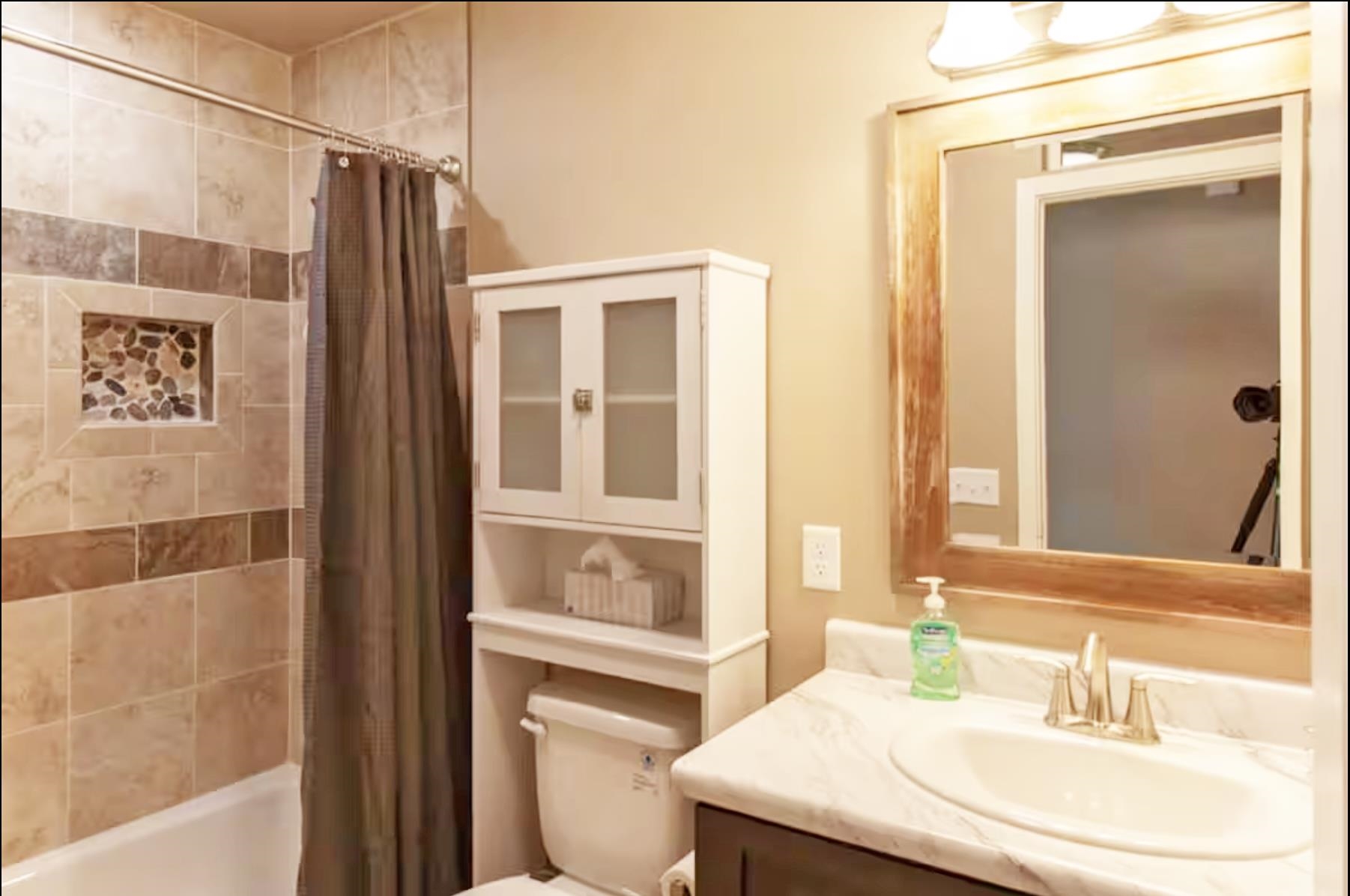 1460 Main Street Grand Junction, CO 81501 - Photo 23 of 31 a bathroom with a sink and a mirror