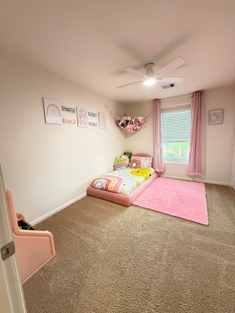 6415 Kentfield Drive Rosharon, TX 77583 - Photo 17 of 21 Spacious secondary bedroom with plush carpet, ceiling fan, and natural light