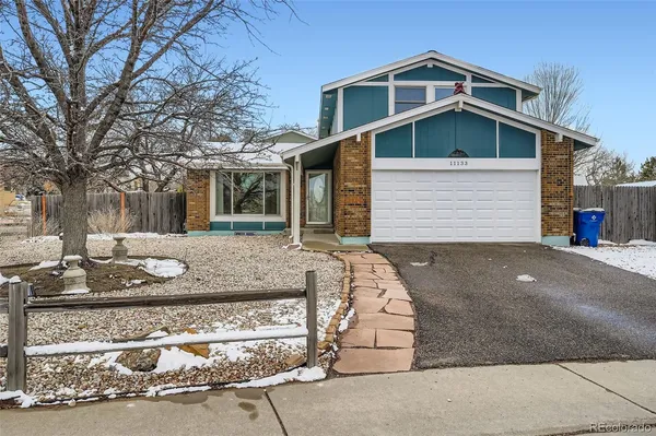 a front view of house with garage