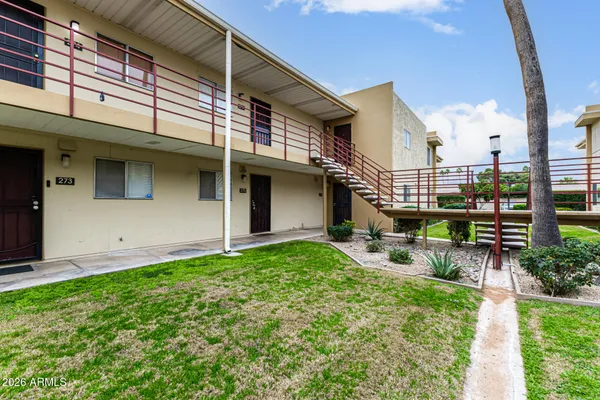 a swimming pool with outdoor seating