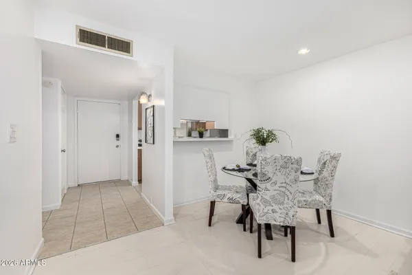 a kitchen with a sink and a potted plant