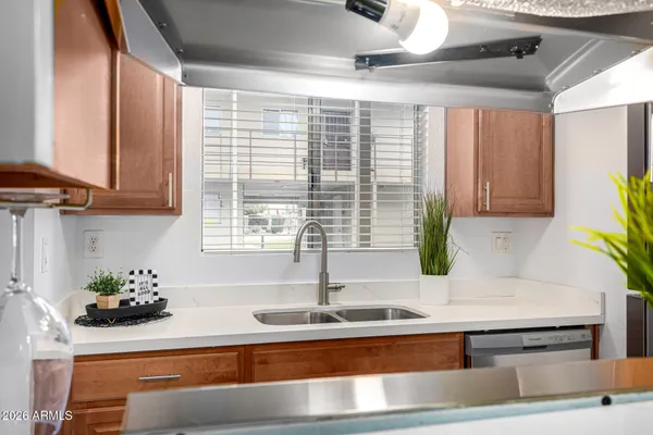 a kitchen with a sink and cabinets