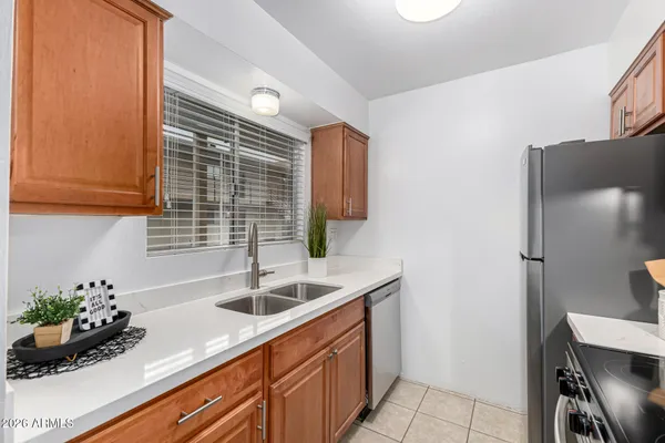 a kitchen that has a sink and a stove