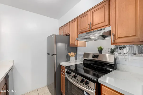 a bathroom with a toilet sink vanity and mirror