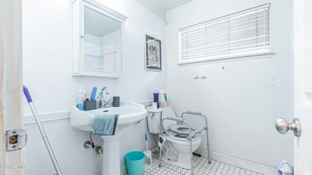 a bathroom with a sink and toilet