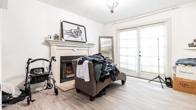 a view of a livingroom with furniture and a fireplace