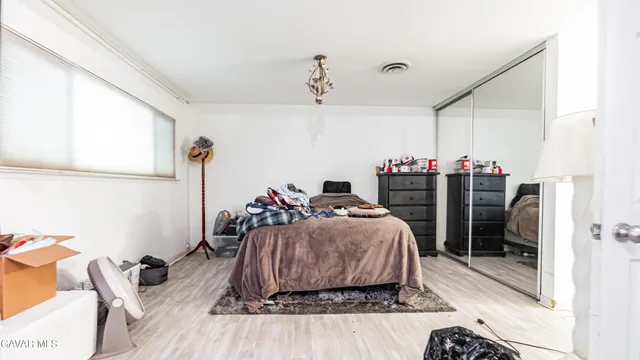 a bed room with a bed and a window