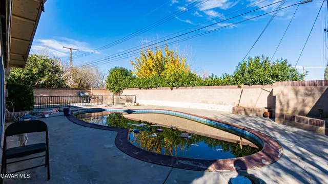 a view of a swimming pool with a patio