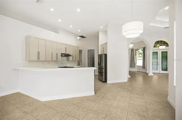 a kitchen with a sink and a refrigerator