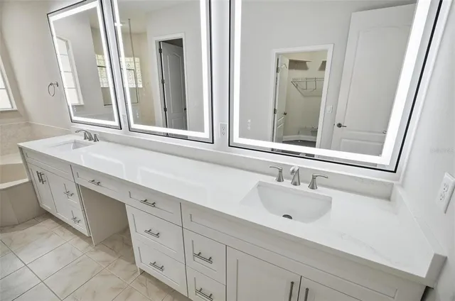 a bathroom with a bathtub and shower