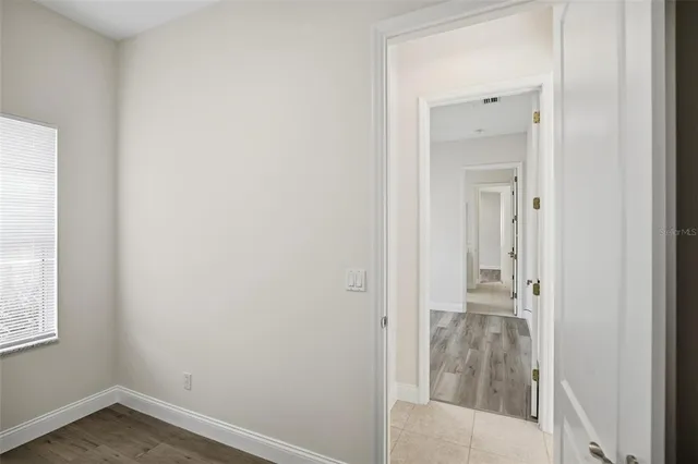 a swimming pool with view of lake in the background