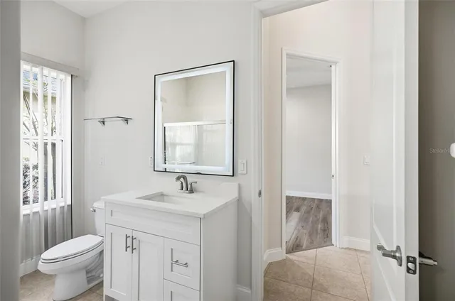 a view of a street with a yard