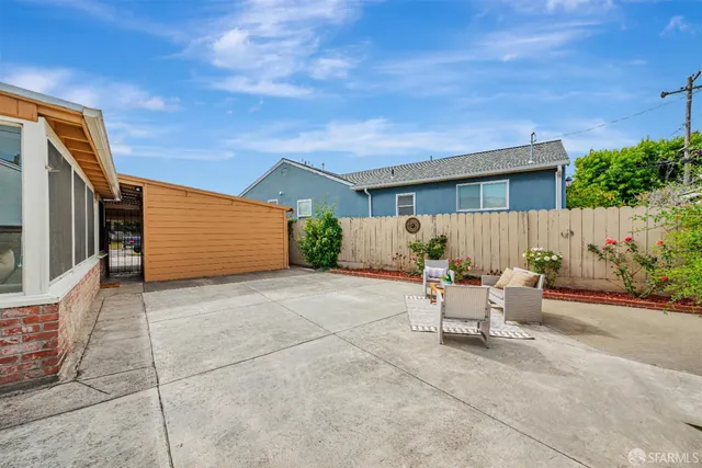 a view of a patio with couches and potted plants