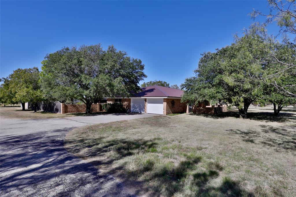 448 Elmdale Road South Abilene, TX 79602 - Photo 3 of 39 a front view of a house with a yard and garage