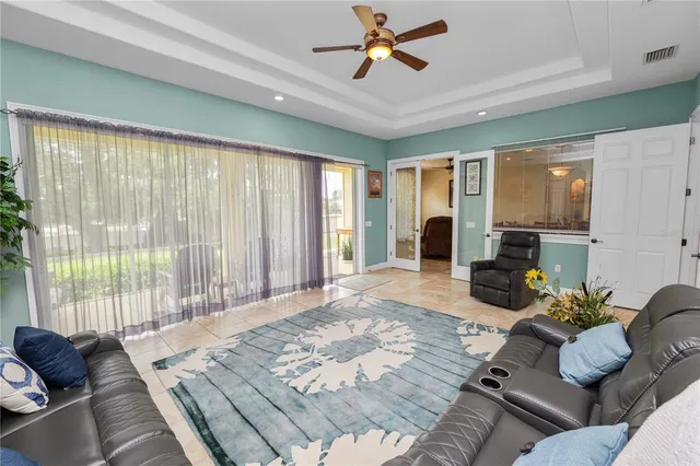 a spacious bathroom with a tub sink and mirror