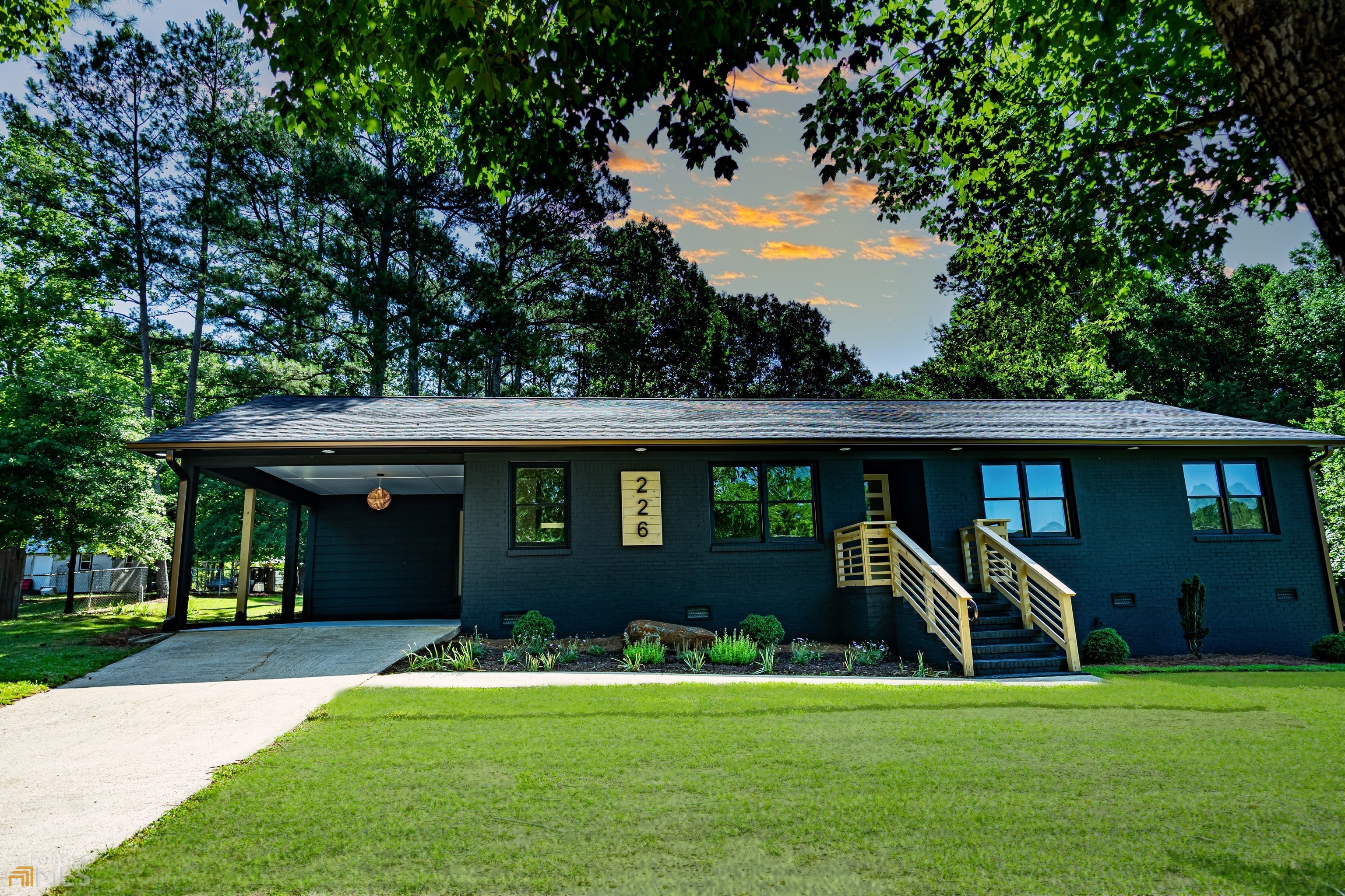 a front view of a house with a yard