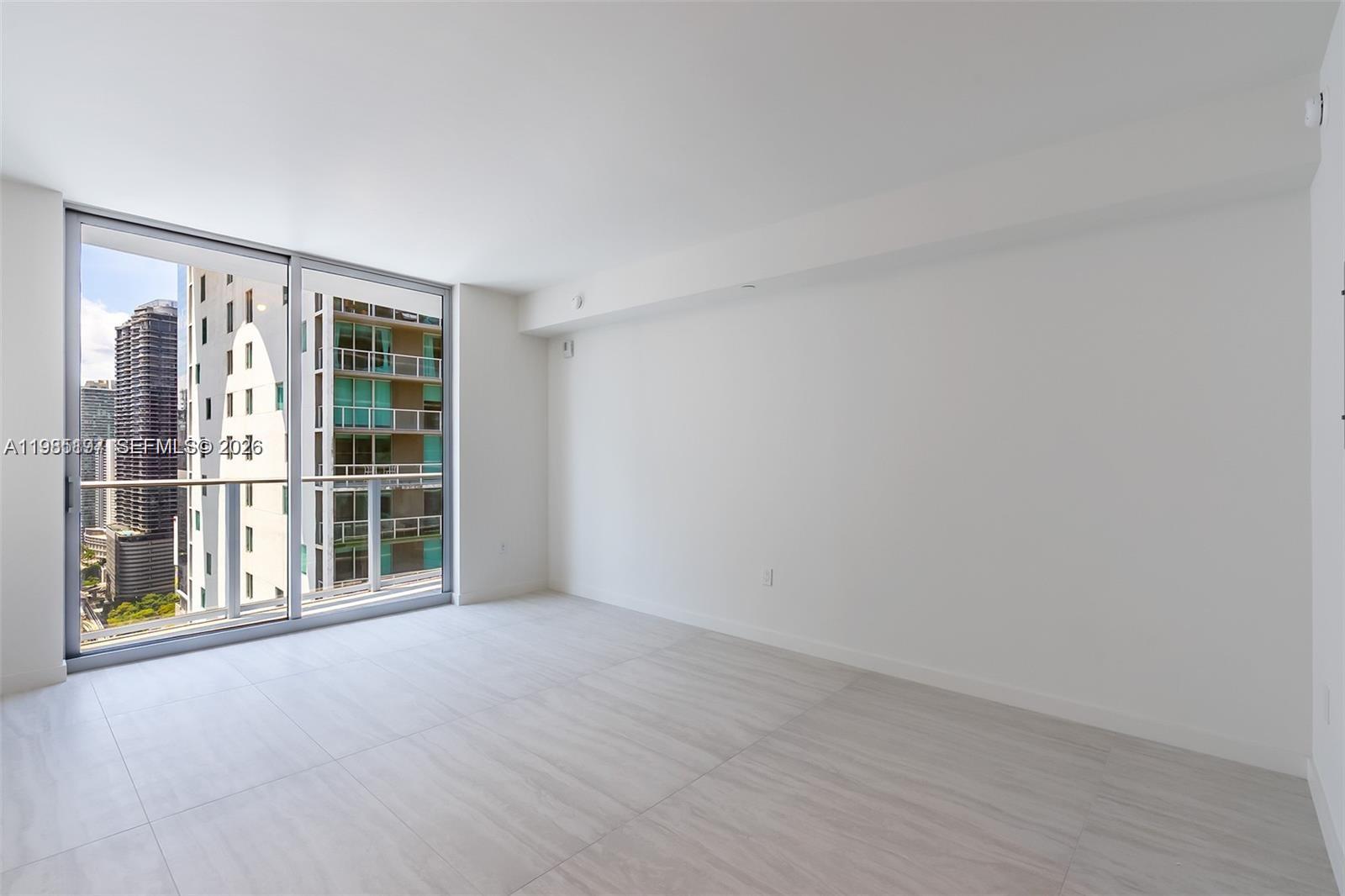 77 Southeast 5th Street, Unit 1513 Miami, FL 33131 - Photo 9 of 49 an empty room with windows