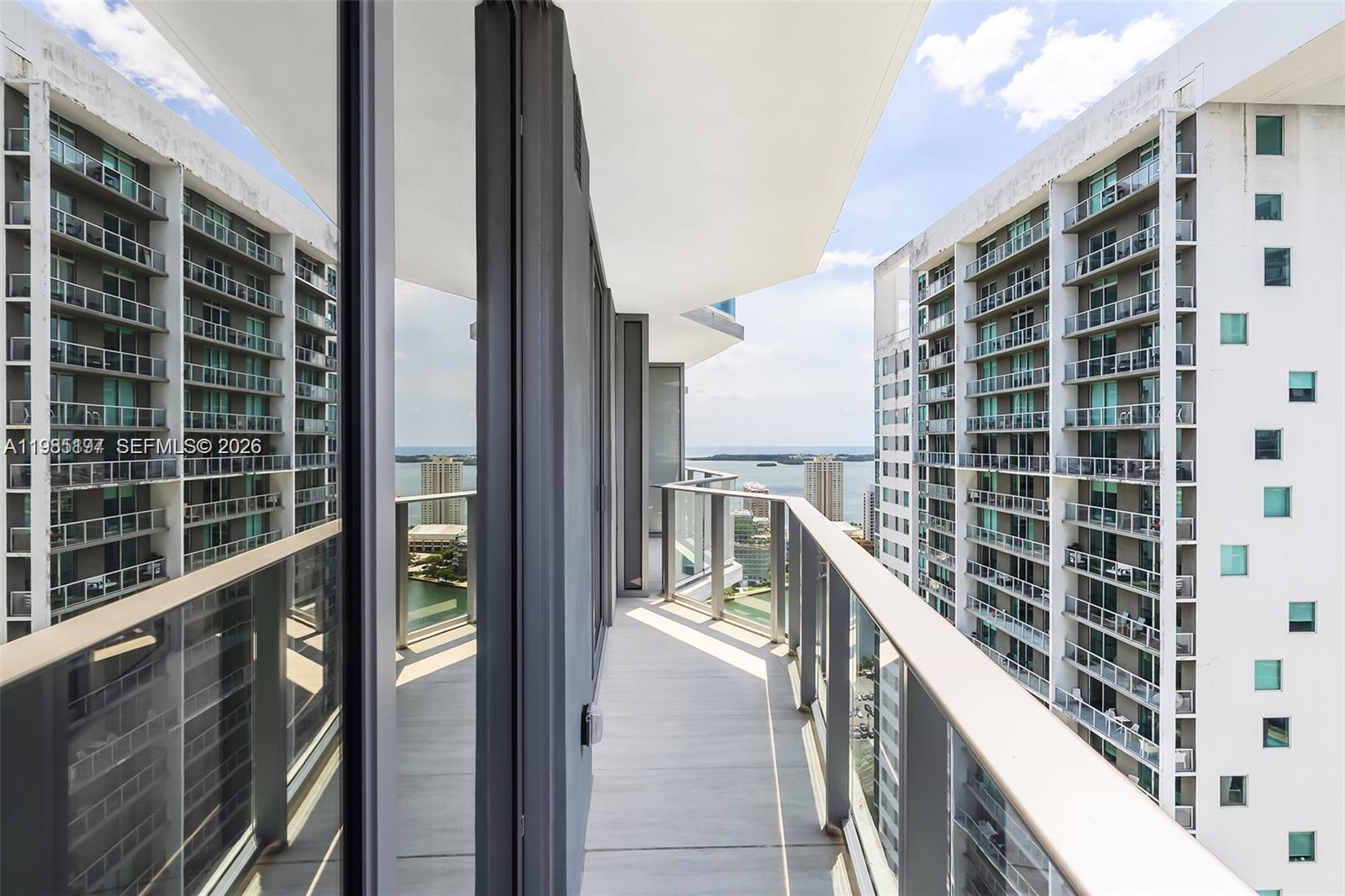 77 Southeast 5th Street, Unit 1513 Miami, FL 33131 - Photo 10 of 49 a view of balcony with a potted plant