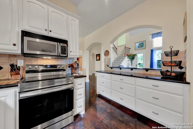 a view of a kitchen with washer and dryer