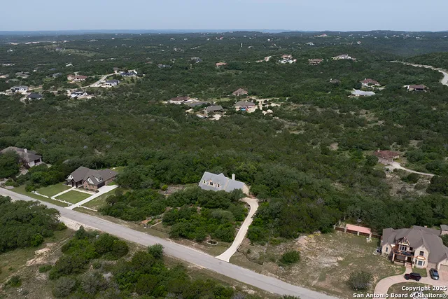 an aerial view of house with yard