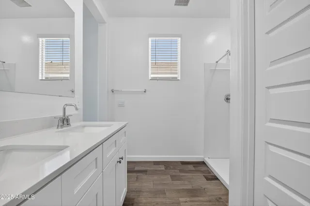 a bathroom with a sink a vanity and a mirror