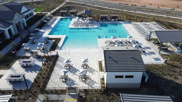 a view of a balcony with two chairs and a stove