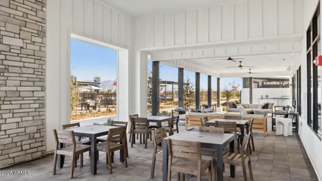 a view of a kitchen with stainless steel appliances granite countertop cabinets and a window