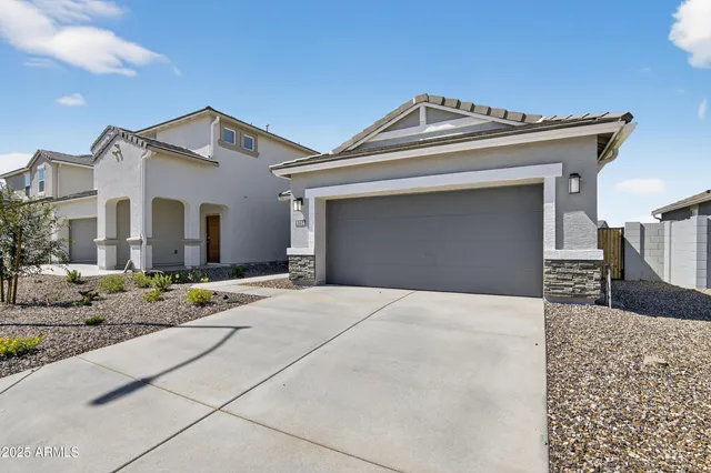 a view of a white house with a outdoor space