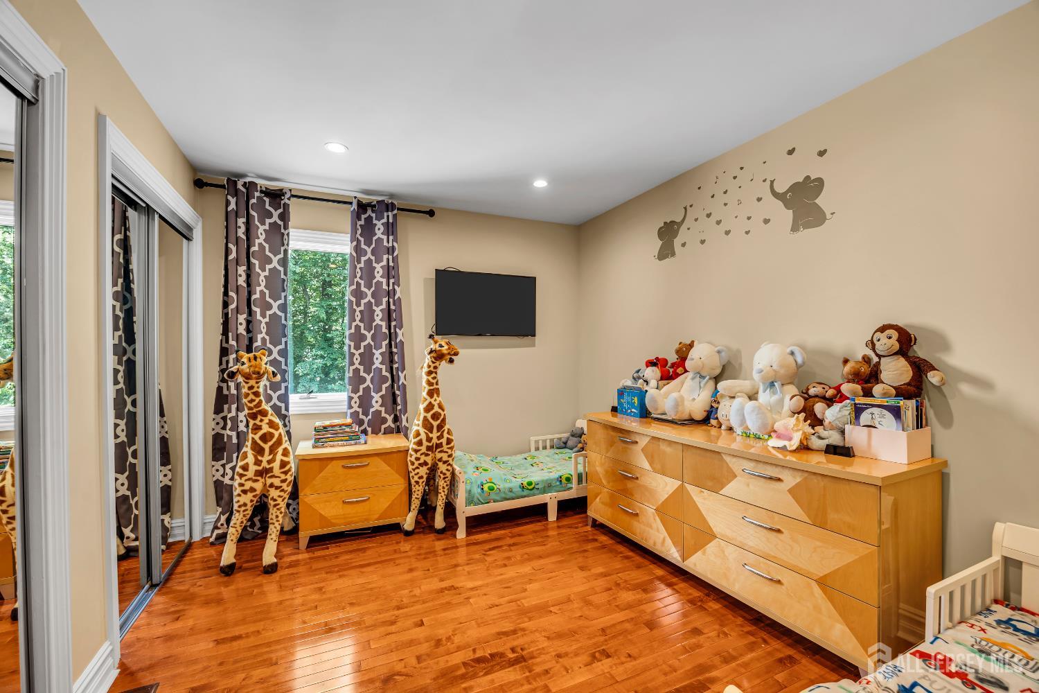 152 Redpine Loop Old Bridge, NJ 08857 - Photo 13 of 27 a bed room with a bed and a tv