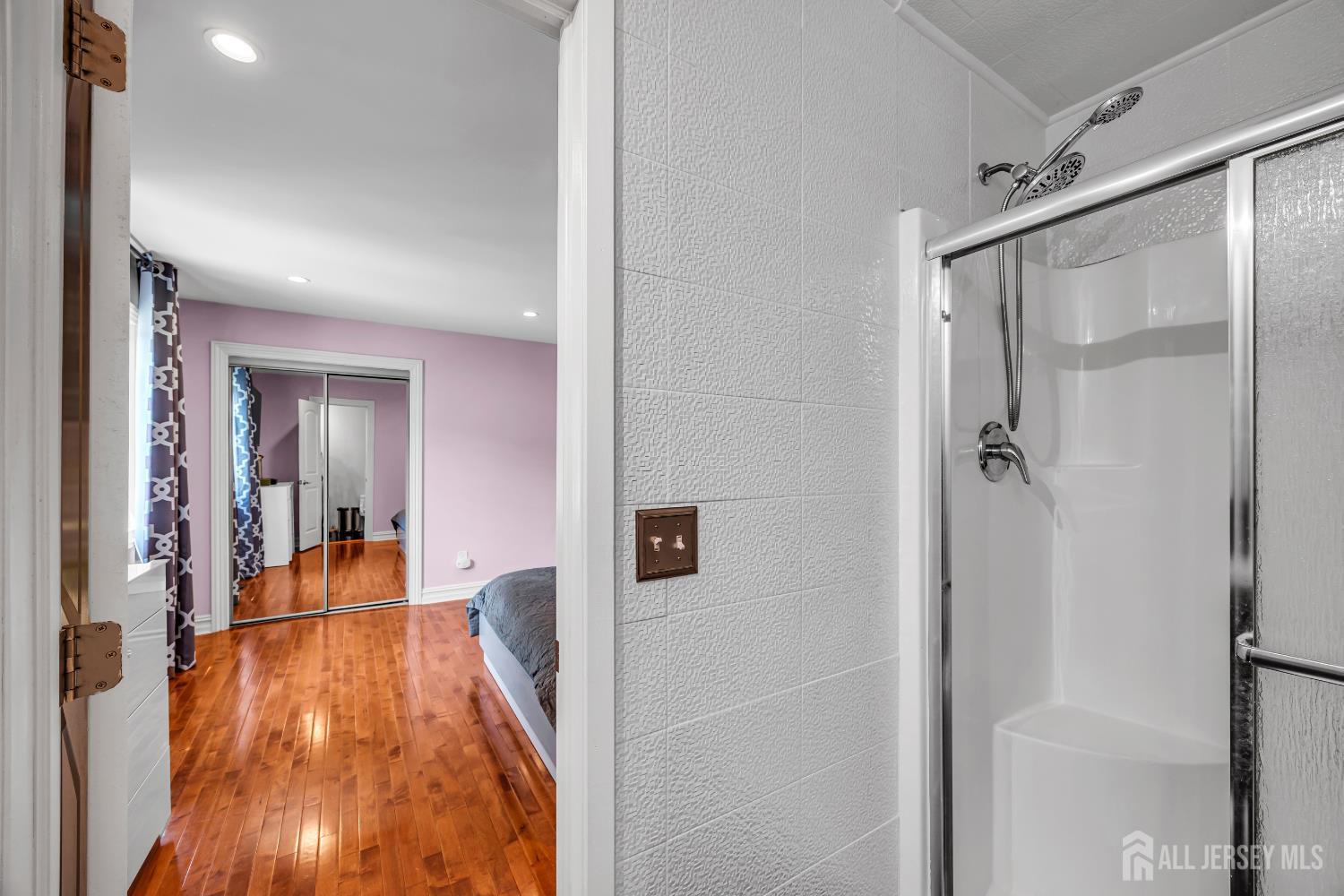 152 Redpine Loop Old Bridge, NJ 08857 - Photo 20 of 27 a view of a hallway with wooden floor and staircase