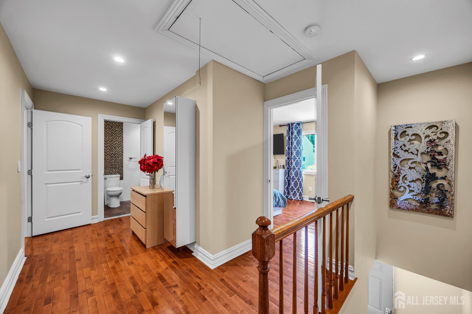 152 Redpine Loop Old Bridge, NJ 08857 - Photo 21 of 27 a very nice looking room with wooden floor and stairs