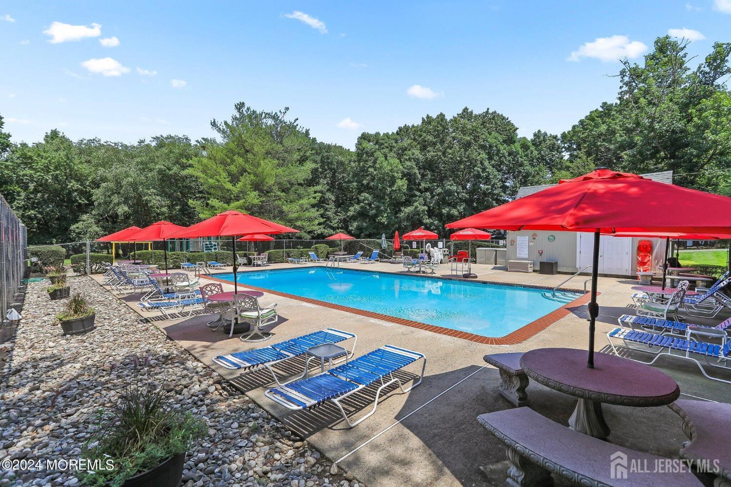 152 Redpine Loop Old Bridge, NJ 08857 - Photo 24 of 27 an outdoor space with pool and chairs
