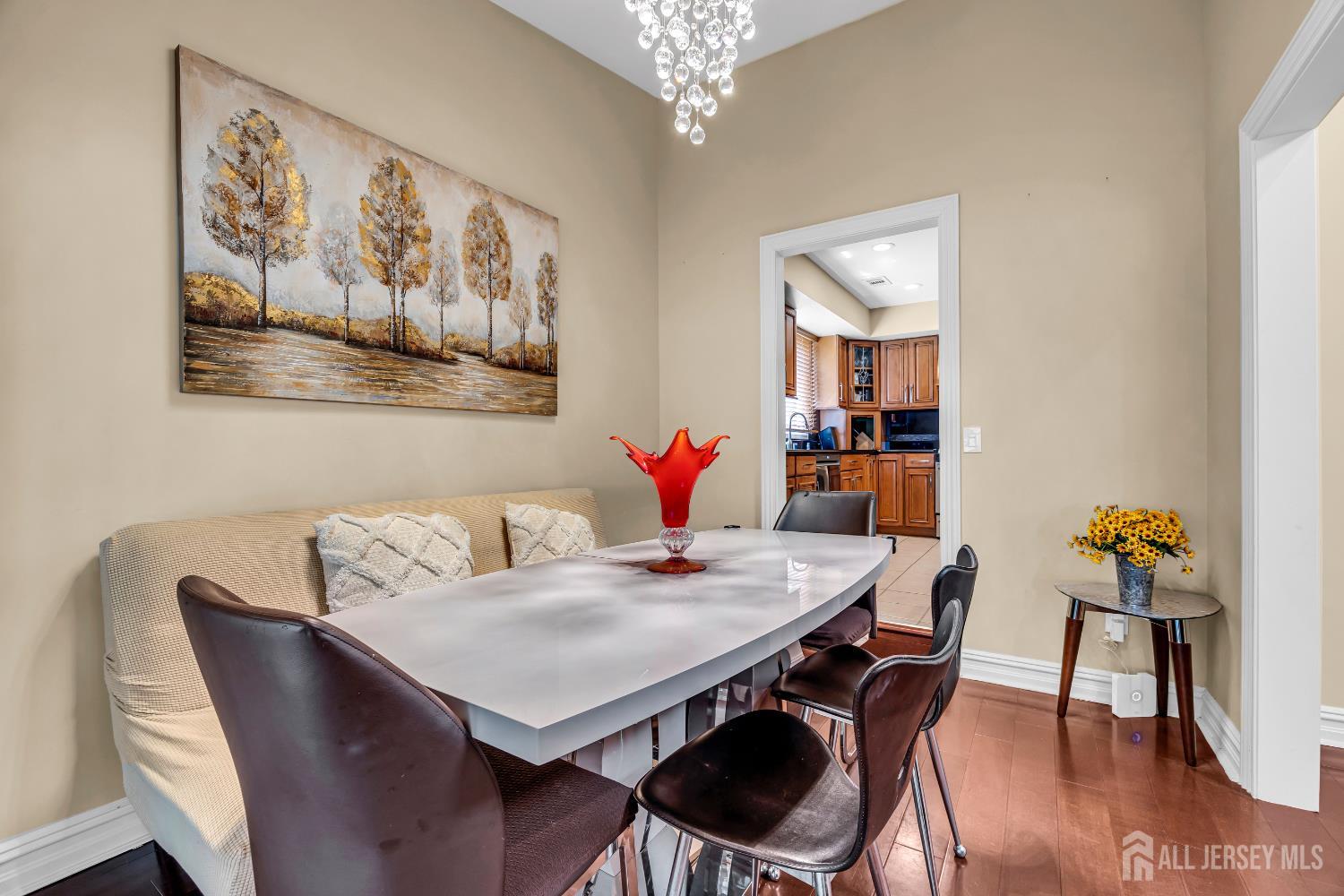 152 Redpine Loop Old Bridge, NJ 08857 - Photo 7 of 27 a view of a dining room with furniture and wooden floor