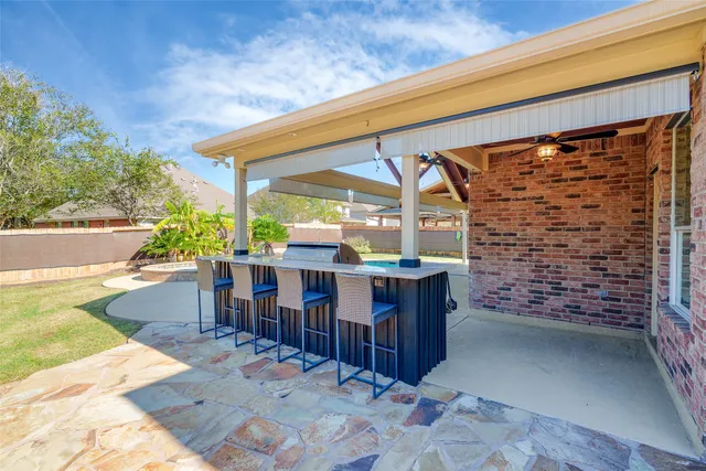 a view of a chairs and table in the patio
