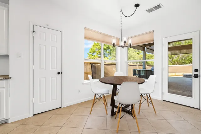 a view of a dining room with furniture window and outside view