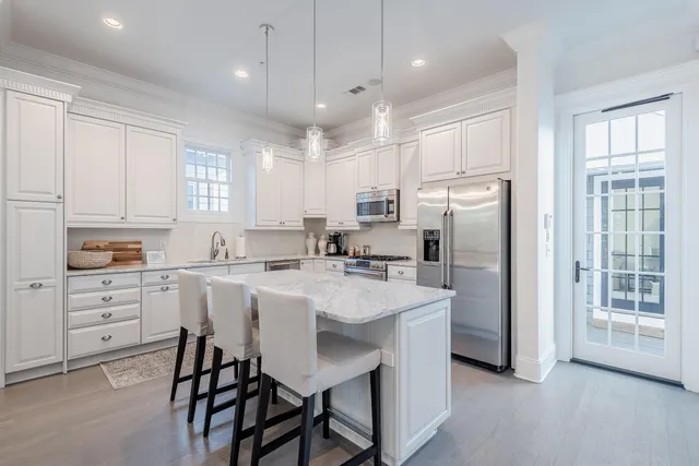 a kitchen with refrigerator cabinets and furniture