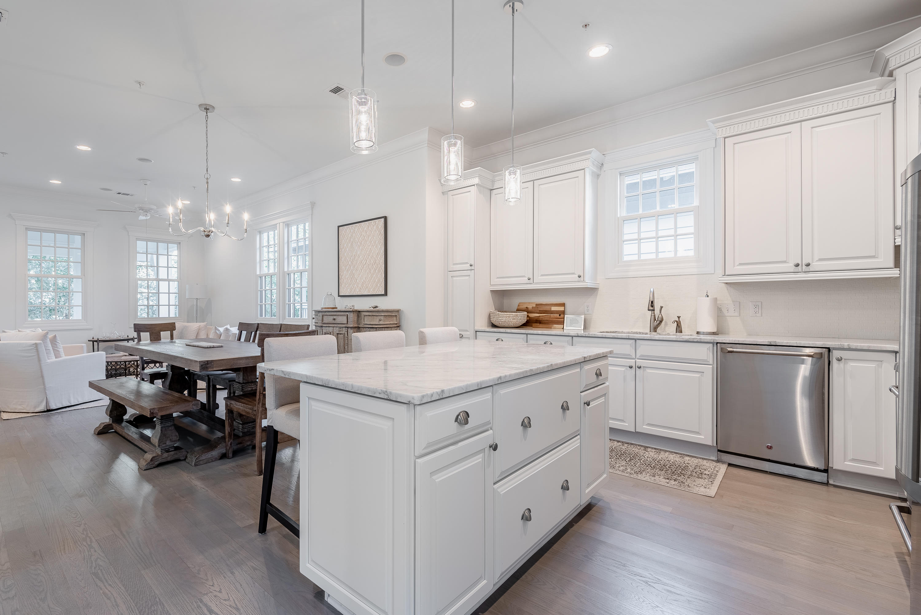 59 West Water Street Inlet Beach, FL 32461 - Photo 13 of 45 a kitchen with kitchen island white cabinets and sink