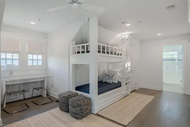 a spacious bedroom with a bed and a window